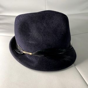 Eugenia Kim rabbit hair hat with feather detail.